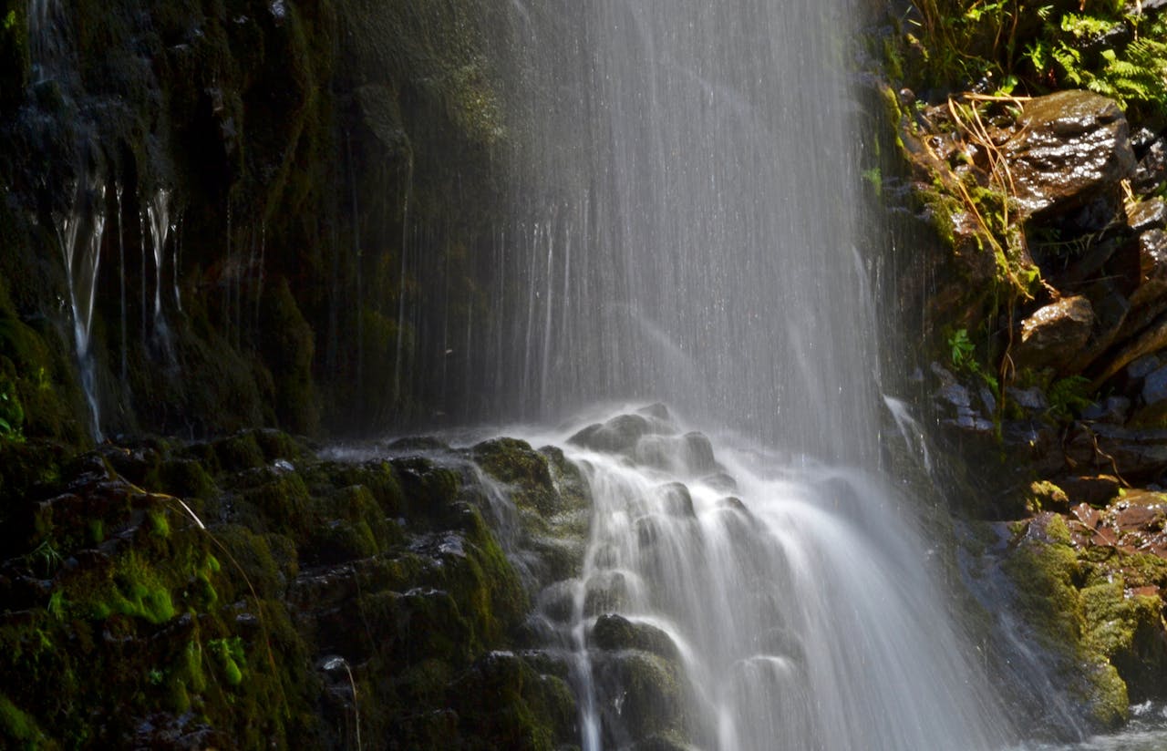 Tranquil waterfall surrounded by lush vegetation in Merlo, San Luis, Argentina.